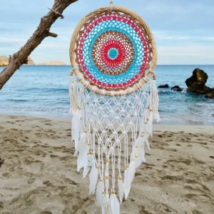 Dream Catcher In some Native American and First Nations cultures, a dreamcatcher is a handmade willow hoop, on which is woven a net or web. It may also be decorated with sacred items such as certain feathers or beads. Traditionally, dreamcatchers are hung over a cradle or bed as protection.